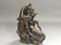 Lot 370 - A Chinese bronze figure holding his sword to his beard
