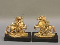 Lot 390 - A pair of gilt bronze Marley horses and horsemen
