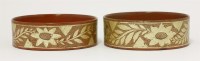 Lot 135 - A pair of red lacquered papier mâché wine coasters