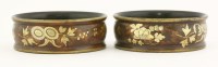 Lot 139 - A good pair of red lacquered papier mâché wine coasters