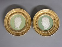 Lot 1204 - A pair of Wedgwood circular green sage Jasper ware panels