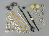 Lot 34 - A Butler & Wilson gold-plated star brooch
