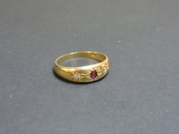 Lot 92 - An Edwardian three stone ruby and diamond star set gypsy ring