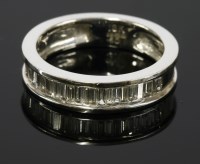 Lot 655 - An 18ct white gold diamond set half eternity ring