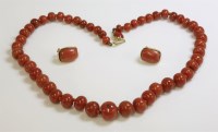 Lot 447 - A single row graduated coral bead necklace