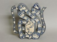 Lot 1327 - An unusual Chinese character teapot