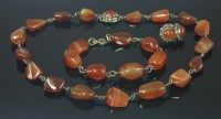 Lot 4 - An Arts and Crafts silver and cornelian matched necklace