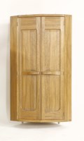 Lot 77 - A walnut hanging corner cabinet