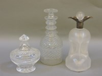 Lot 323 - An unusual glass decanter with silver collar