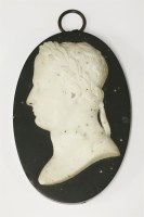 Lot 72 - A white marble relief bust of a Roman