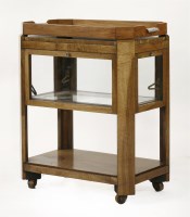 Lot 128 - An Art Deco two-tier walnut trolley
