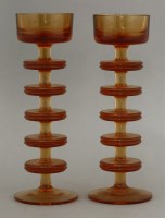 Lot 534 - A pair of Wedgwood topaz glass Sheringham candlesticks