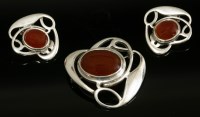 Lot 9 - A cased sterling silver Art Nouveau-style brooch and earring suite by Liberty