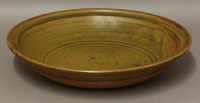 Lot 575 - A stoneware dish