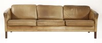 Lot 399 - A Danish tan leather three-seater settee