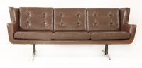 Lot 414 - A brown leather three-seater settee