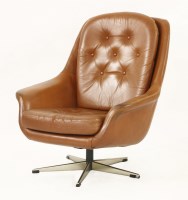 Lot 431 - A Danish swivel lounge armchair