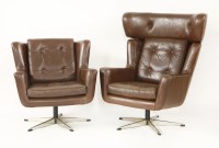 Lot 621 - Two brown leather swivel chairs