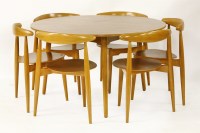 Lot 418 - A teak and beech dining table