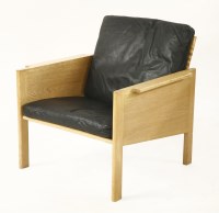 Lot 457 - An oak armchair