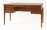 Lot 518 - A Danish teak desk