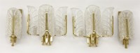 Lot 626 - A set of four glass and brass mounted wall lights