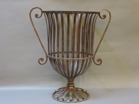 Lot 607A - A wrought iron strapwork urn