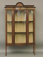 Lot 597 - An Edwardian bow front display cabinet 115cm wide