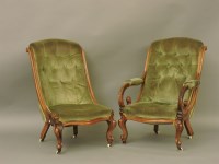 Lot 673 - A pair of Victorian walnut framed easy chairs