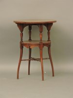 Lot 672 - An Edwardian inlaid walnut circular occasional table
