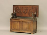 Lot 615 - A reproduction oak monk's bench