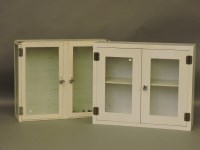 Lot 714 - Two glazed white painted steel cabinets