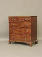 Lot 738 - A George III mahogany chest of two short of three long drawers