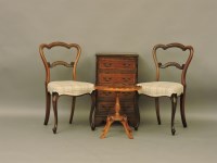Lot 650 - A pair of Victorian rosewood balloon back chairs