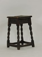 Lot 613 - An interesting 18th century rustic oak square stool