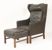 Lot 684 - A brown leather high back armchair