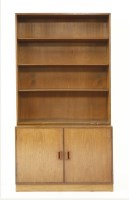 Lot 724 - A teak open bookcase