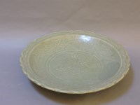 Lot 517 - A Chinese green celadon dish