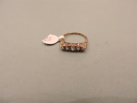 Lot 25 - An Edwardian gold five stone diamond ring