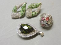 Lot 15 - A 9ct white gold and coloured sapphire cluster ring