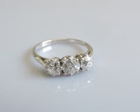 Lot 26 - A three stone graduated diamond ring