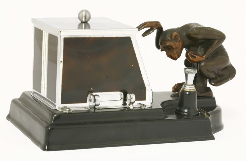 Lot 167 - An Art Deco cigarette dispenser and strike lighter