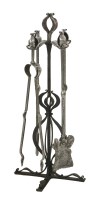 Lot 85 - A set of Arts and Crafts steel fire irons