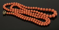 Lot 444 - A single row graduated coral bead necklace