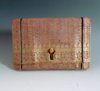 Lot 503 - A Cartier Art Deco magenta and metallic gold thread woven Indian fabric evening clutch bag