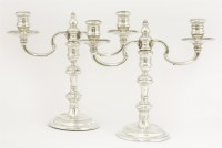 Lot 63 - A pair of silver two-light candelabra