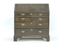 Lot 711 - A George III oak bureau