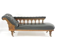 Lot 390 - An oak chaise longue