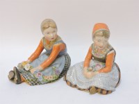 Lot 80 - A pair of Royal Copenhagen figures of Dutch girls holding flowers