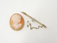 Lot 12 - A gold diamond quatrefoil cluster bar brooch